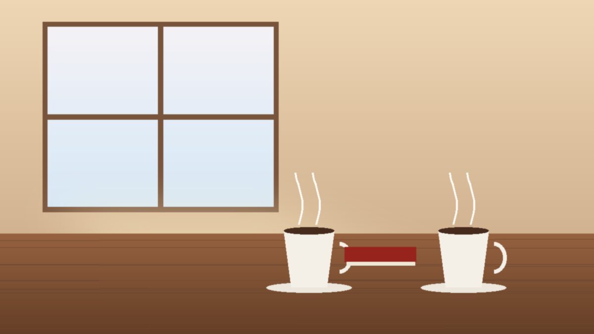 Two coffee cups on a wooden table in morning window light, with a small closed book beside them